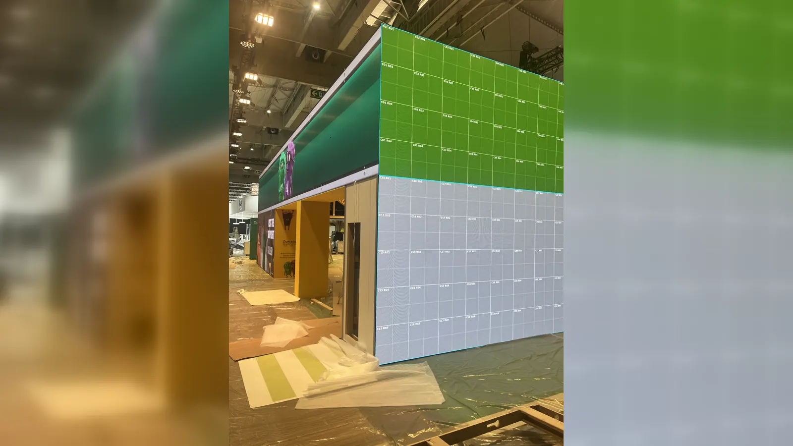Large multi-surface LED installation showing a module coordinate grid during setup