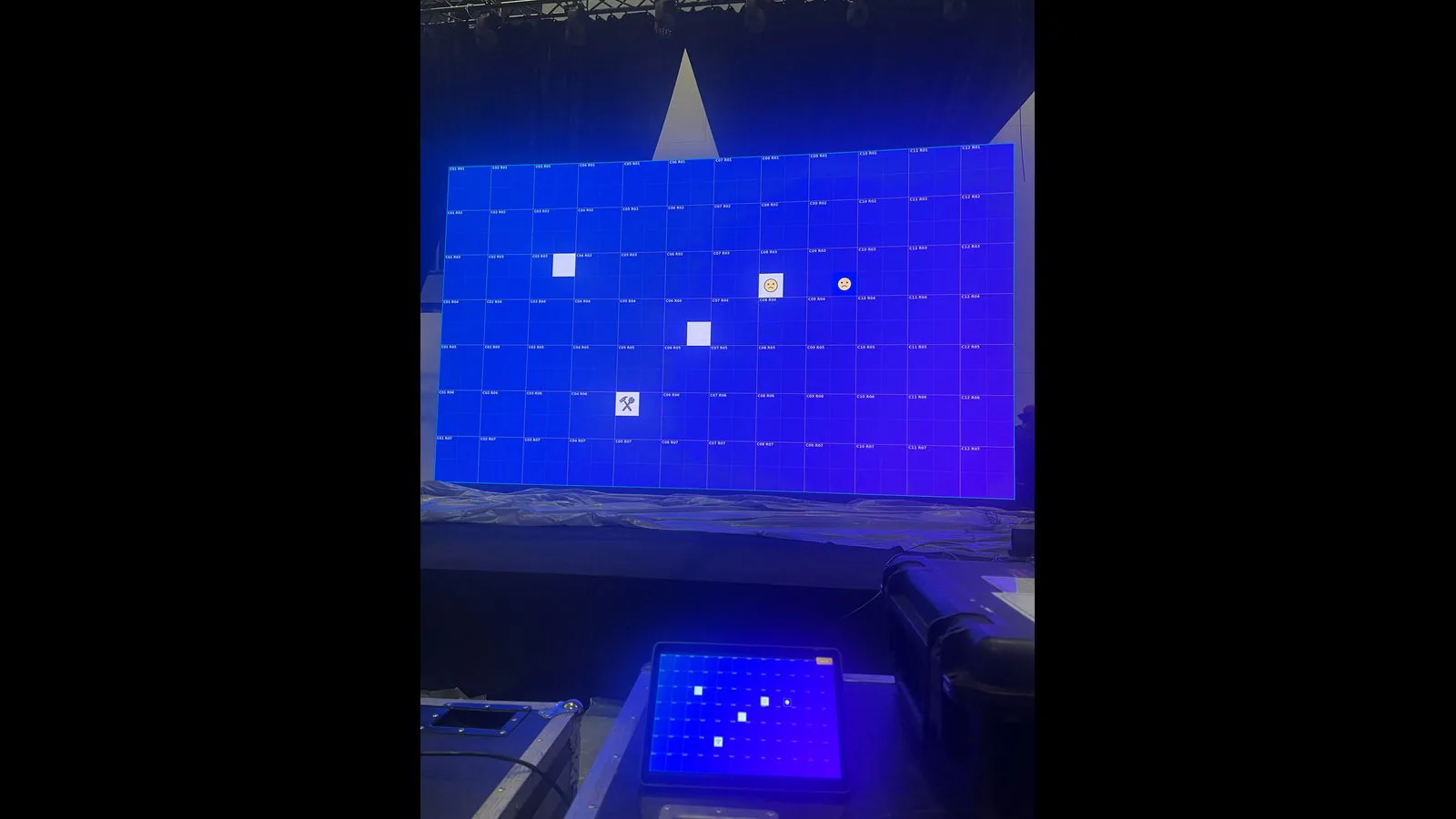 Blue LED wall with module coordinates and several custom IM Locator icons
