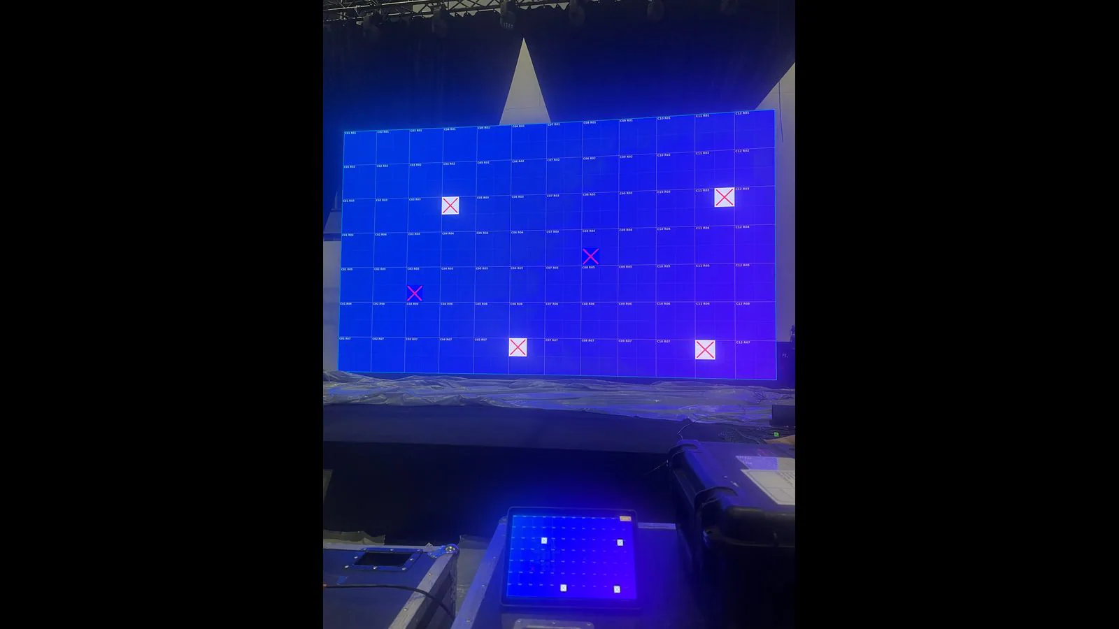 Blue LED wall with exact red and white cross markers for individual modules