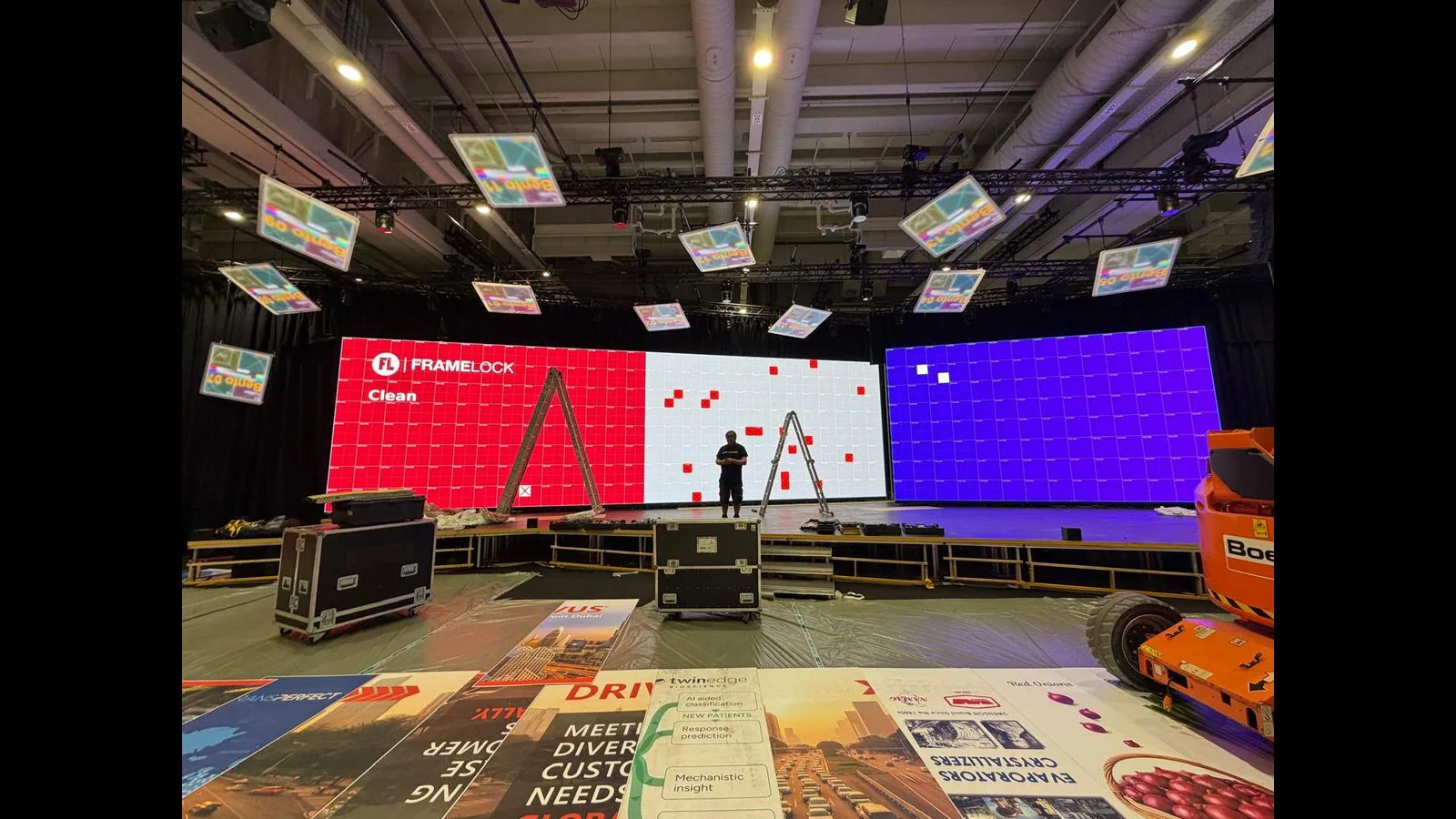 Large event LED walls showing module coordinates and IM Locator markers during service work